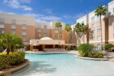 a swimming pool in front of a hotel at SpringHill Suites by Marriott Orlando Lake Buena Vista in Marriott Village in Orlando
