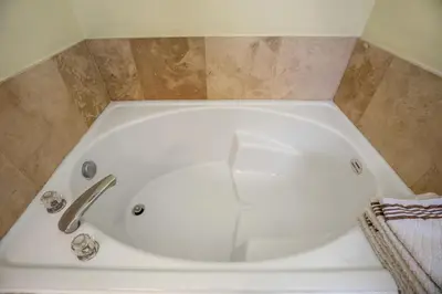 a white bath tub in a bathroom at Sun Palm Disney Villa in Kissimmee