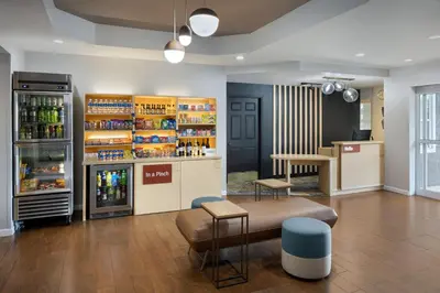 a room with a store with a drink refrigerator at TownePlace Suites by Marriott Orlando East/UCF Area in Orlando