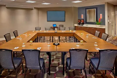 a large conference room with a large table and chairs at Residence Inn Orlando Lake Mary in Lake Mary