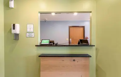 a mirror on the wall of a doctors office at Extended Stay America Select Suites - Orlando - East in Orlando