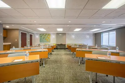 a classroom with rows of tables and chairs with water bottles at SpringHill Suites Orlando Altamonte Springs/Maitland in Orlando