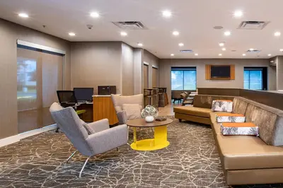 a lobby with couches and chairs and a desk at SpringHill Suites Orlando Altamonte Springs/Maitland in Orlando