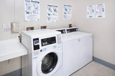a washing machine and a dryer in a laundry room at Residence Inn by Marriott Orlando Altamonte Springs Maitland in Orlando