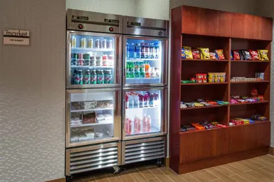 a refrigerator filled with lots of drinks in a store at SpringHill Suites by Marriott Orlando North-Sanford in Sanford