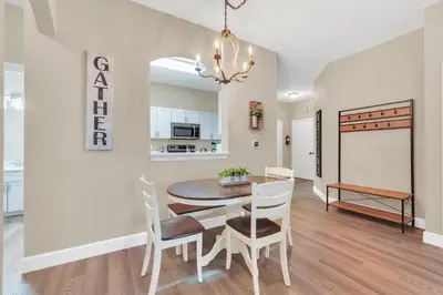 a kitchen and dining room with a table and chairs at Disney Bunk Room--Windsor Hills in Orlando