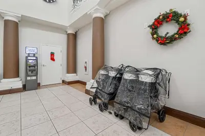 a waiting room with three wrapped shopping carts at Lake Buenavista Apartments close to Disney in Orlando