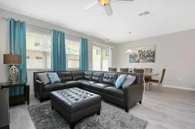 a living room with a couch and a table at Four Bedrooms Townhome 5108K in Kissimmee