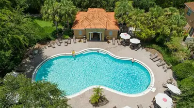 an overhead view of a swimming pool at a resort at Four Bedrooms Townhome 5108K in Kissimmee