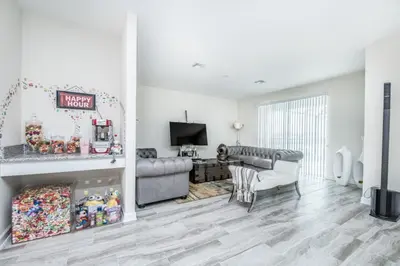 a living room with a couch and a fireplace at King Castle Circle Villa #237082 in Kissimmee