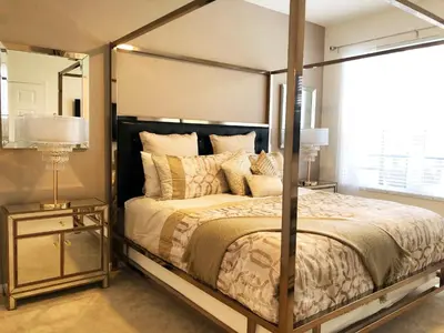 a bedroom with a large bed with a metal frame at Windsor Hills Resort - Enchanted Crystal Castle in Orlando