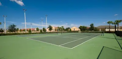 a tennis court with a net on top of it at Windsor Hills Resort - Enchanted Crystal Castle in Orlando