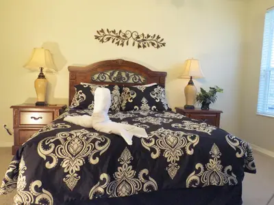 a bedroom with a black and white bed with a skeleton on it at Formosa Garden Pool Home in Kissimmee