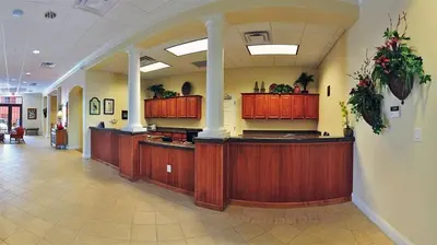 a lobby with wooden counters in a building at Condo Blue Heron in Orlando