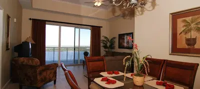 a living room with a couch and a table at Penthouse Blue Heron Condo in Orlando