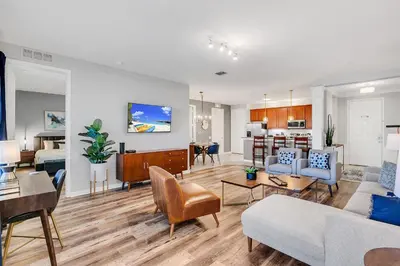 a living room with a couch and a table at Vero`s Gem Condo in Orlando