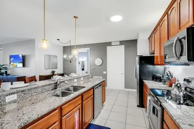 a kitchen with a sink and a counter top at Vero`s Gem Condo in Orlando
