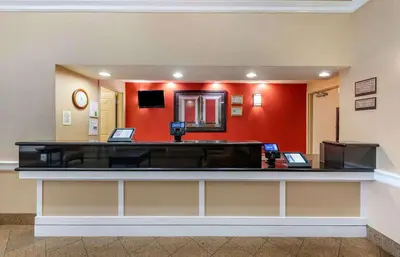 a lobby with a reception desk in a hospital at Extended Stay America Suites - Orlando - Southpark - Commodity Circle in Orlando