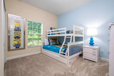 a bedroom with a white bunk bed and a window at Five Bedrooms TownHome with Pool 4849 in Kissimmee