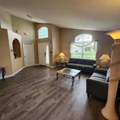 a living room with a couch and a coffee table at Lake Berkley Home #213517 in Kissimmee