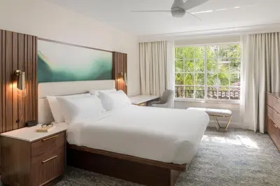 a bedroom with a large white bed and a window at Marriott's Lakeshore Reserve in Orlando
