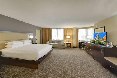a large hotel room with a bed and a television at Hilton Orlando/Altamonte Springs in Orlando