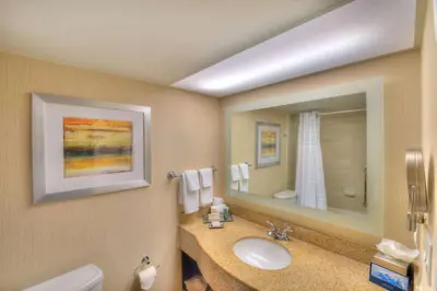 a bathroom with a sink and a mirror at Hilton Orlando/Altamonte Springs in Orlando