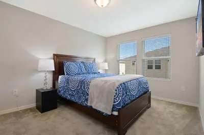 a bedroom with a bed and a window at Four Bedrooms TownHome 5130 in Kissimmee
