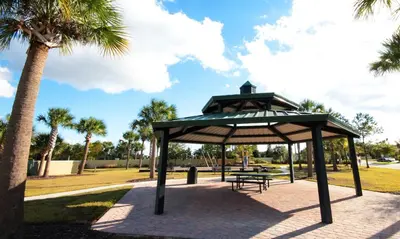 a gazebo in a park with a palm tree at Four Bedrooms TownHome 5130 in Kissimmee