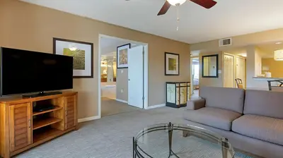 a living room with a couch and a flat screen tv at Bluegreen Vacations Orlando's Sunshine Resort in Orlando