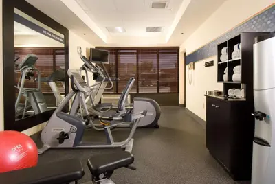 a gym with a treadmill and a elliptical machine at Hampton Inn Orlando Near Universal Blv/International Dr in Orlando