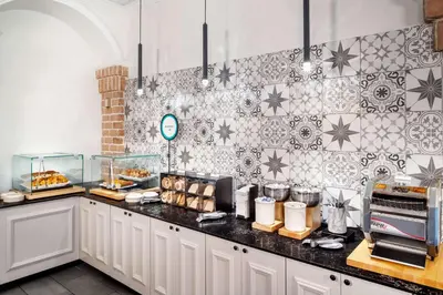 a kitchen with a counter with food on it at Embassy Suites by Hilton Orlando North in Orlando