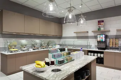 a kitchen with a counter with bananas on it at Residence Inn by Marriott Orlando at Millenia in Orlando