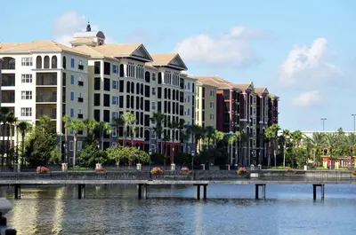 a bridge over a body of water with buildings at Hilton Grand Vacations Club Tuscany Village Orlando in Orlando