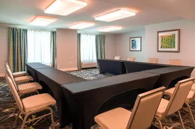 a conference room with a long table and chairs at Hilton Garden Inn Orlando East - UCF Area in Orlando