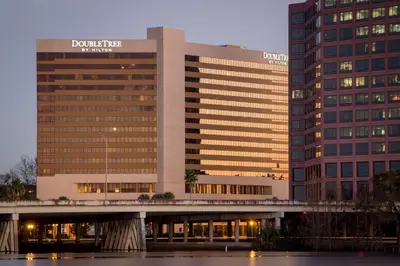 a building with a bridge in front of it at DoubleTree by Hilton Orlando Downtown in Orlando