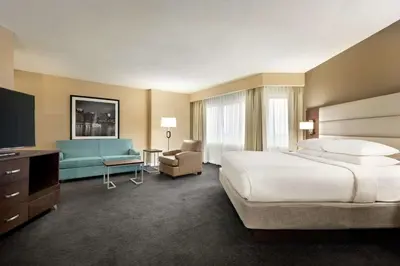 a hotel room with a large bed and a television at DoubleTree by Hilton Orlando Downtown in Orlando