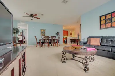a living room with a couch and a table at Gorgeous 1st-Floor, End Unit Condo w LAKEVIEW in Orlando