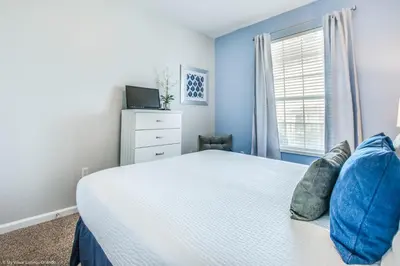 a bedroom with a bed and a window at Stunning Top-Floor Condo, next to Clubhouse in Orlando