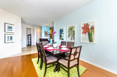 a dining room and living room with a table and chairs at Treasure Palace in Orlando