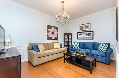 a living room with a couch and a table at Treasure Palace in Orlando