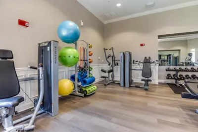 a gym with cardio equipment and exercise bikes at Stylish Vista Cay Condo, near Orlando attractions in Orlando