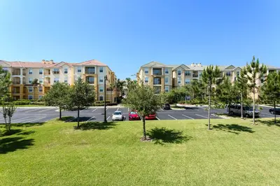 a view of a parking lot at a apartment complex at 3-Story Townhome at Vista Cay Resort in Orlando