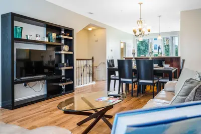 a living room with a couch and a dining room at 3-Story Townhome at Vista Cay Resort in Orlando