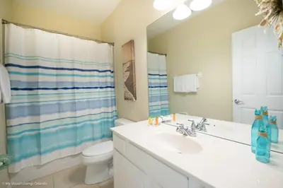 a bathroom with a sink and a toilet and a shower at Spacious Vista Cay Townhome Newly Furnished in Orlando