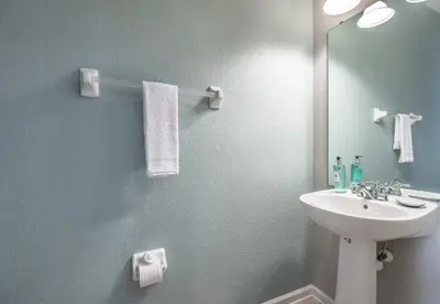a bathroom with a sink and a mirror at At Tideview in Orlando