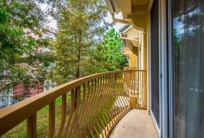 a balcony of a house with a window at At Tideview in Orlando