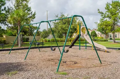 a playground with a slide in a park at Four Bedrooms TownHome 5161 in Kissimmee