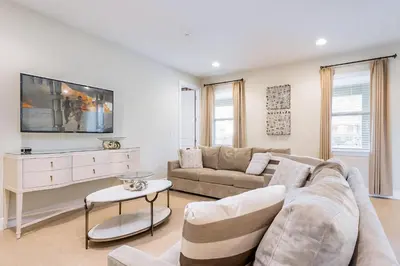 a living room with a couch and a table at Welcoming Home With Private Pool Near Disney With Waterpark & Resort Access At Encore Resort - 761La in Kissimmee