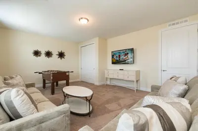 a living room with a couch and a table at Welcoming Home With Private Pool Near Disney With Waterpark & Resort Access At Encore Resort - 761La in Kissimmee